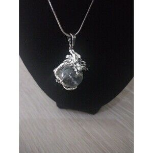 Silver Plated Dragon Wrapped Around A Natural Clear Quartz Gemstone